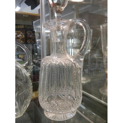 1197 - Three unusual shaped glass decanters.