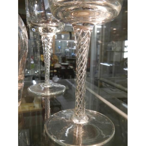 1201 - A glass decanter and four twist stem wine goblets.