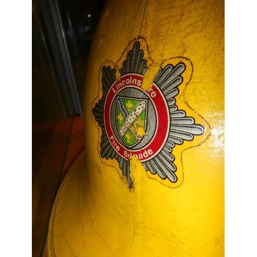 1204 - A vintage Lincolnshire fire brigade helmet,