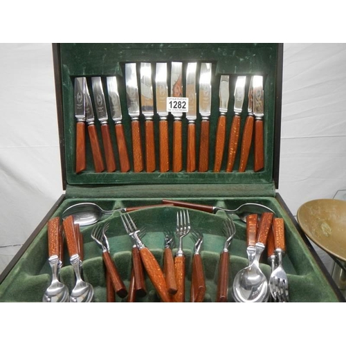 1282 - Three cased sets of cutlery.