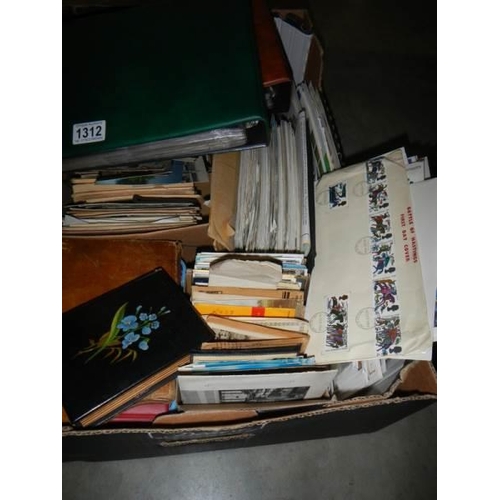 1312 - A large box of mixed postcards, stamps and albums etc.,