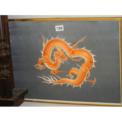 1366 - A pair of framed and glazed embroideries on silk of dragons.