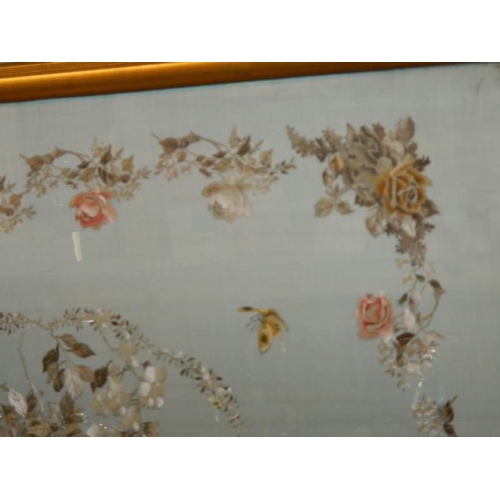 1368 - A large embroidery on silk of flowers and birds. COLLECT ONLY