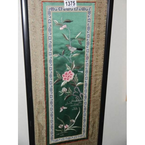 1375 - Two framed and glazed embroideries on silk.