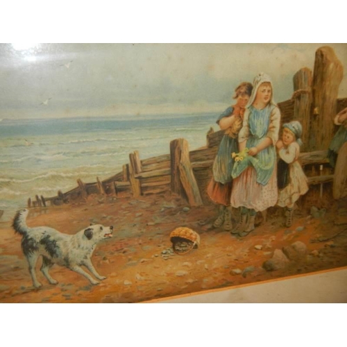 1406 - A framed and glazed print featuring children with dog on a beach.