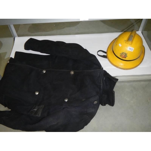 1412 - A vintage Humberside fire brigade helmet and a jacket.