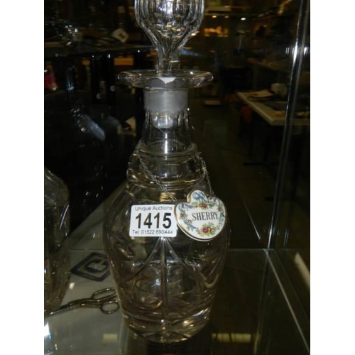 1415 - Two early 20th century decanters with lables.