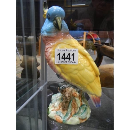 1441 - Three Beswick birds including a parrot.