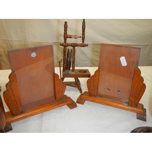 1223 - A pair of Edwardian wooden photo frames, pair of wooden candlesticks and a miniature spinning wheel.