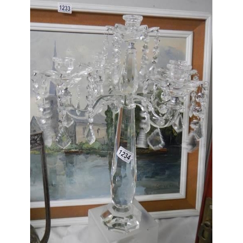 1234 - A glass five branch table centrepiece candle holder.