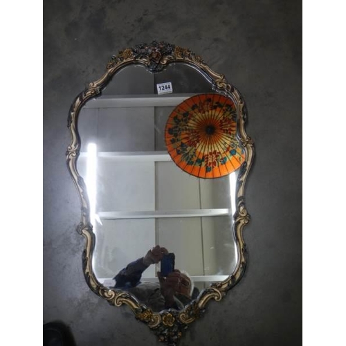 1244 - A mid 20th century mirror in decorative frame, COLLECT ONLY