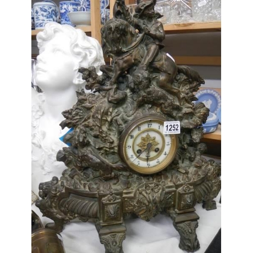 1252 - A heavy cast iron mantel clock.