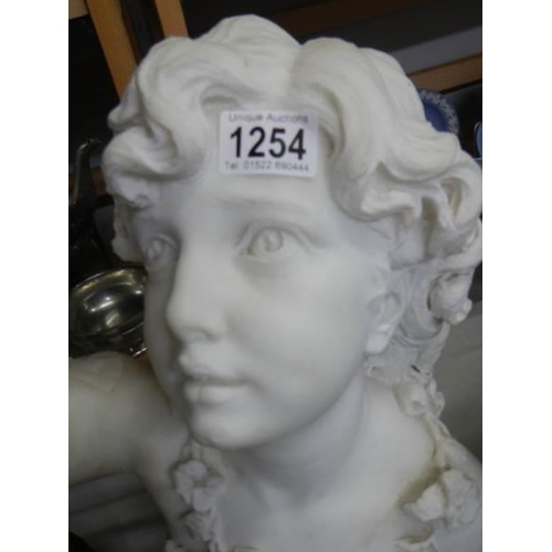 1254 - A heavy Italian marble bust of a young girl, 47 cm tall.