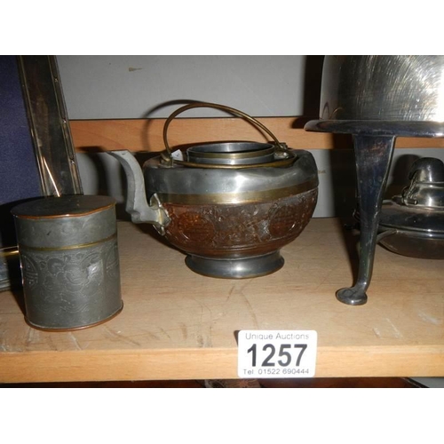 1257 - A silver plate kettle on stand and other silver plate.