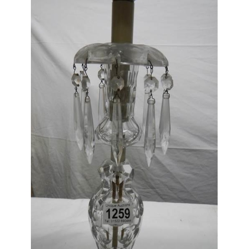 1259 - A Victorian cut glass table lamp.