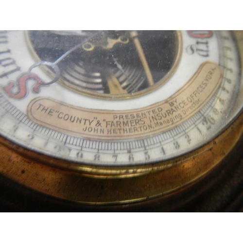 1260 - An Edwardian mahogany barometer presented by the County & Farmers Insurance Offices York.