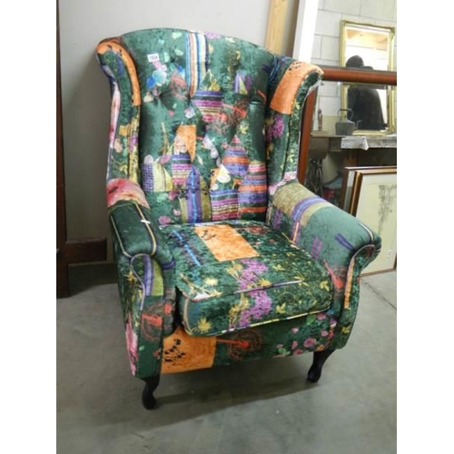 1504 - A wing armchair with multi coloured upholstery, COLLECT ONLY.