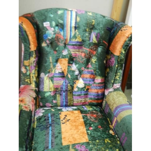 1504 - A wing armchair with multi coloured upholstery, COLLECT ONLY.