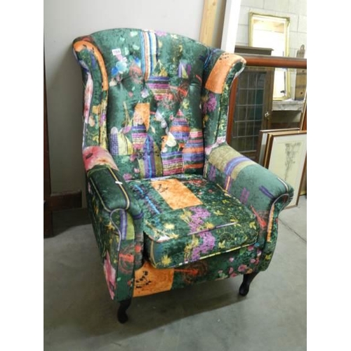 1504 - A wing armchair with multi coloured upholstery, COLLECT ONLY.