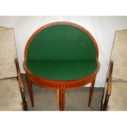 1543 - An early 20th century fold over mahogany card table,. COLLECT ONLY.