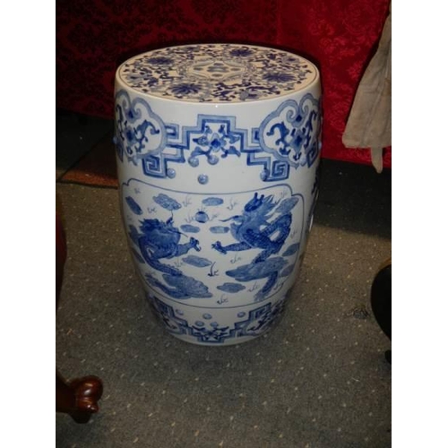 1554 - A blue and white Chinese garden stool. COLLECT ONLY.