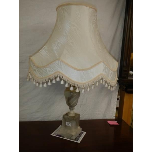 1577 - An alabaster table lamp with shade.