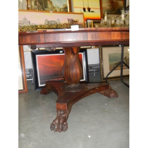 1579 - A Victorian rosewood tip top dining table.