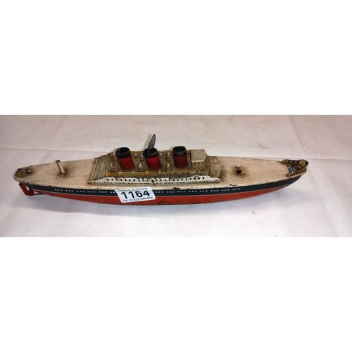 1164 - An early 20th century tin plate clockwork ocean liner by Arnold, Germany, 32 cm long.