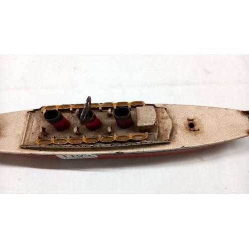 1164 - An early 20th century tin plate clockwork ocean liner by Arnold, Germany, 32 cm long.