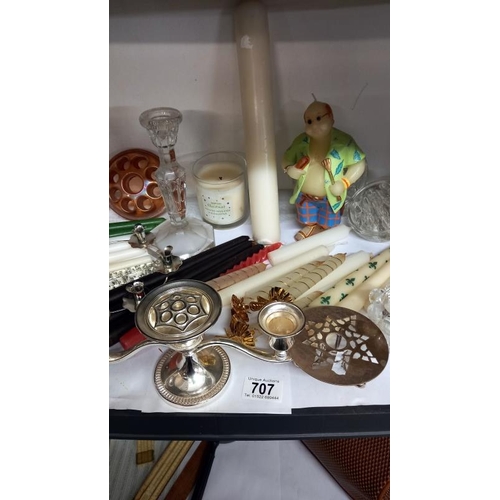 707 - A shelf of miscellaneous candles & candle holders etc.