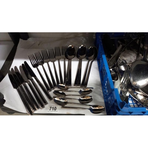 710 - A quantity of stainless steel cutlery etc.