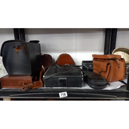 718 - A large quantity of vintage empty camera cases, 4 shelves