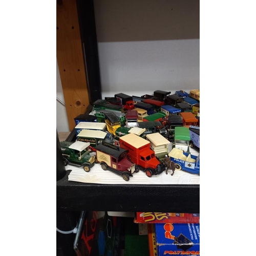 733 - A large collection of unboxed Lledo die cast vans & cars
