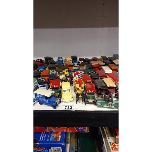 733 - A large collection of unboxed Lledo die cast vans & cars