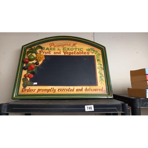 748 - An advertising chalk board depicting fruit & veg