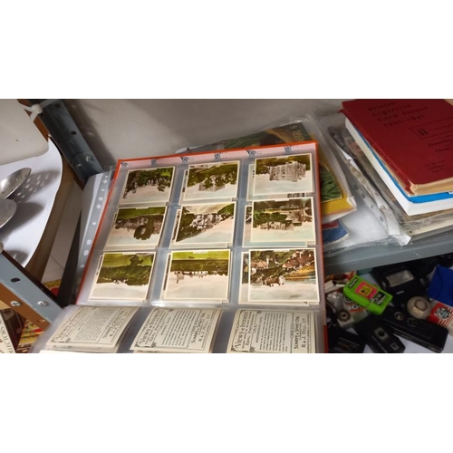 765 - A mixed collection of cigarette cards including black cat, albums, other cards & sets & vintage guid... 