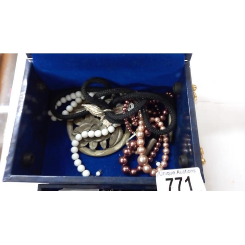 771 - A jewellery box & contents