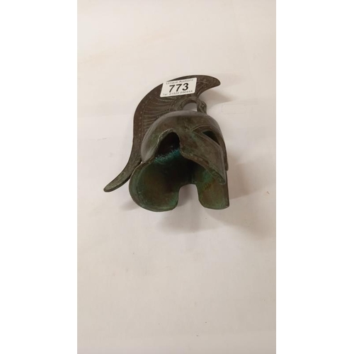 773 - A small bronze replica of a Roman Centurian helmet, height 17cm