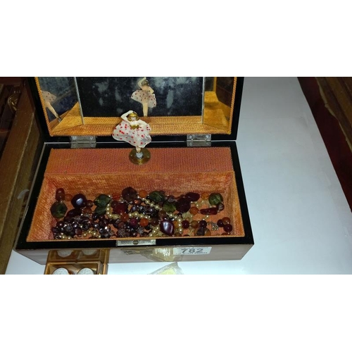 782 - A jewellery box & contents including Royal Crown Derby thimbles etc.