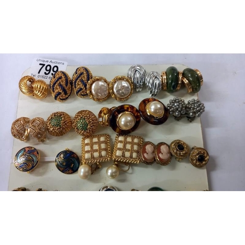 799 - A good selection of vintage clip on earrings