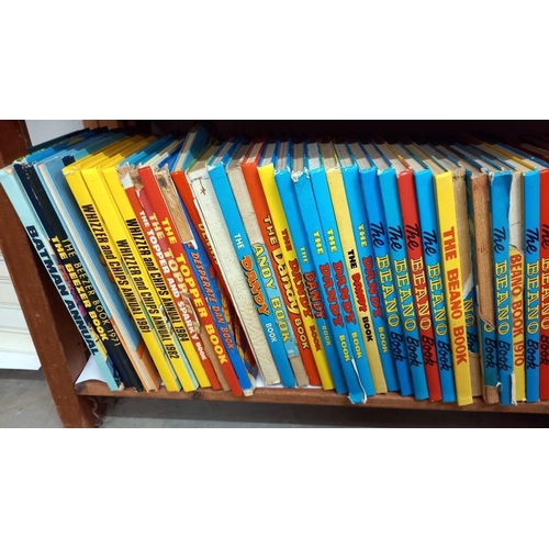 810 - A large quantity of 1970's/80's children's annuals including Beano, Batman, Dandy, Beezer & Buster e... 