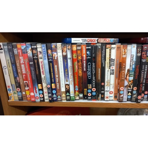 819 - 2 shelves of DVD's plus 2 Blu Ray