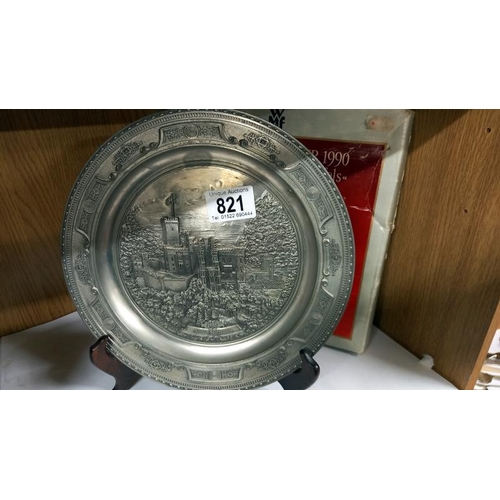 821 - A boxed WMF plate with embossed castle scene.