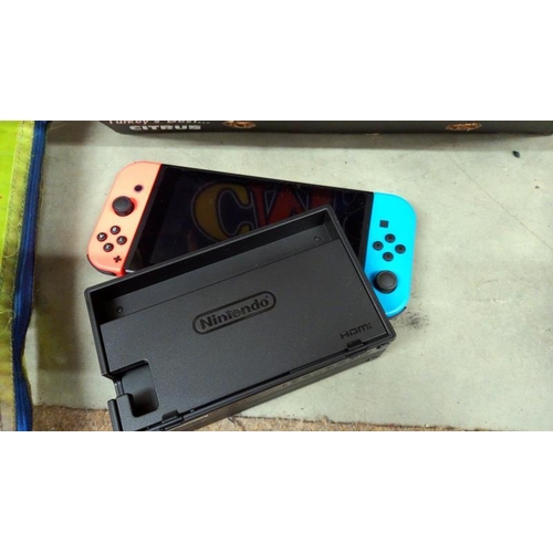 825 - A box of miscellaneous including crayons & Nintendo Switch (untested)