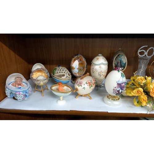 828 - A quantity of decorative eggs etc.