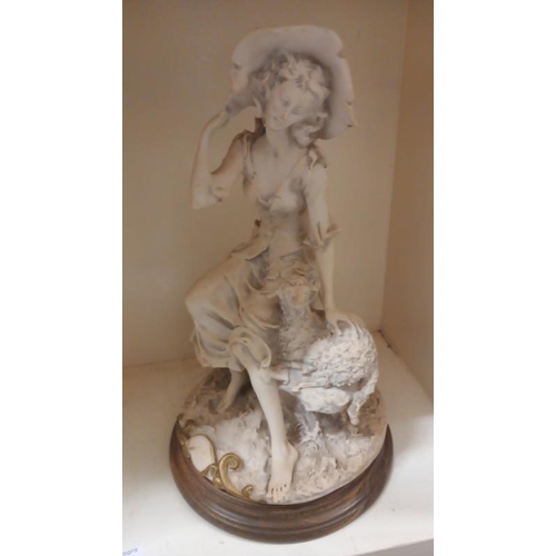 871 - A Shepherdess figure with lamb