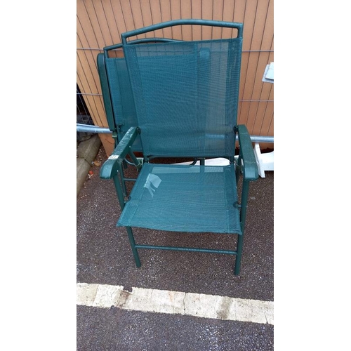 880 - A pair of green folding garden chairs