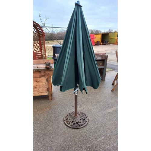 888 - A garden parasol with cast iron base, COLLECT ONLY