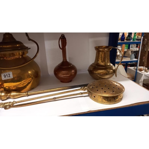 912 - A selection of brass & copper including chestnut roaster, foot warmer & brass kettle etc.