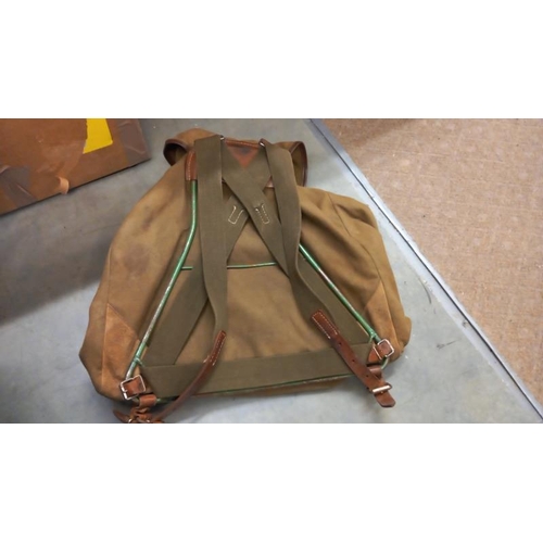 944 - An old scout like ruck sack on metal frame with leather fittings